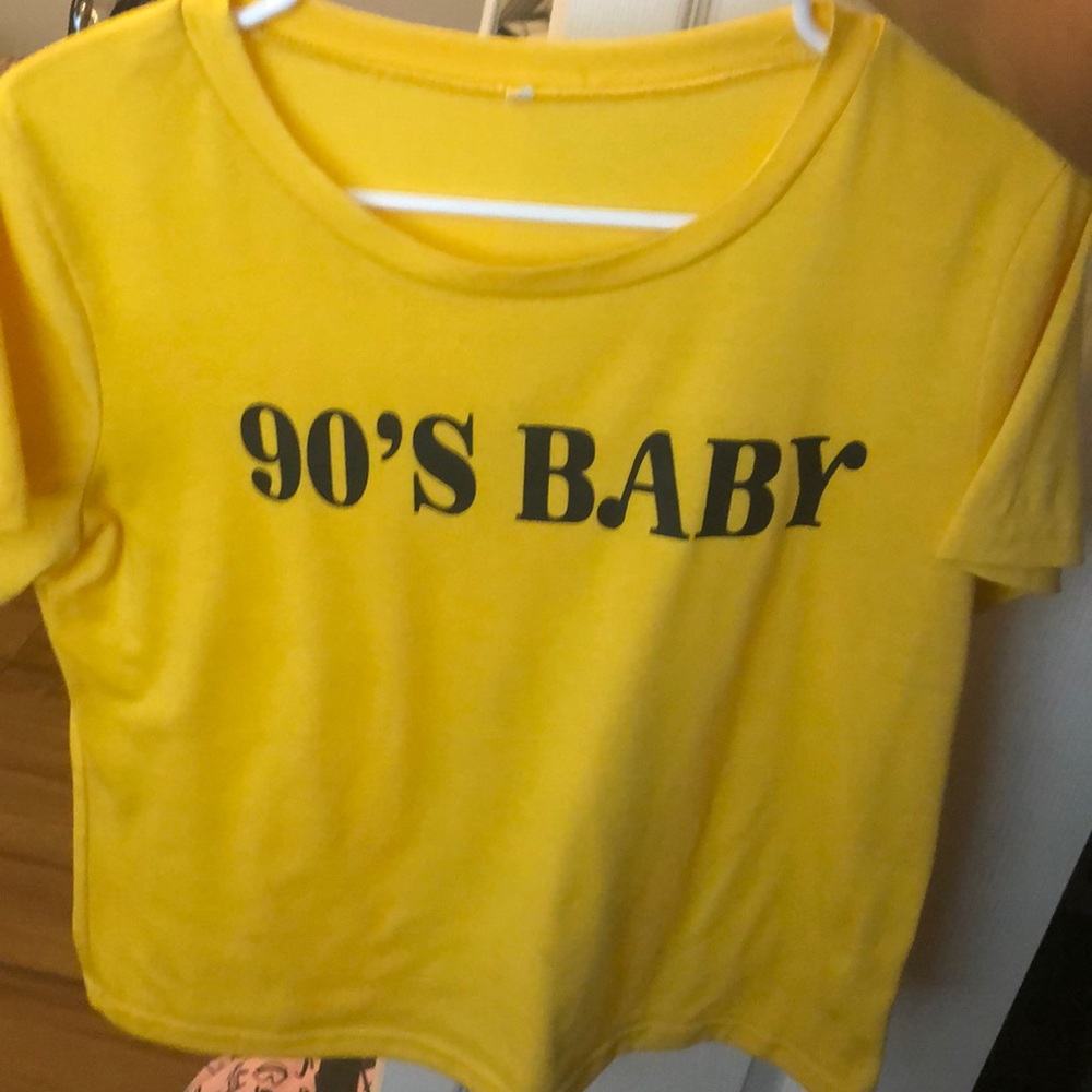 A yellow “90’s baby” shirt